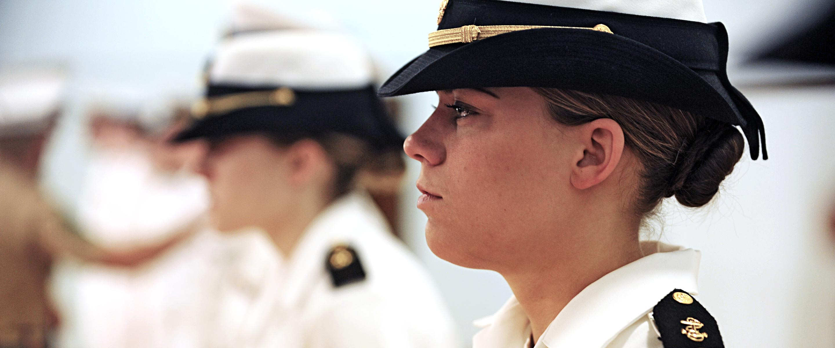 Navy officer  in full uniform during a formal ceremony