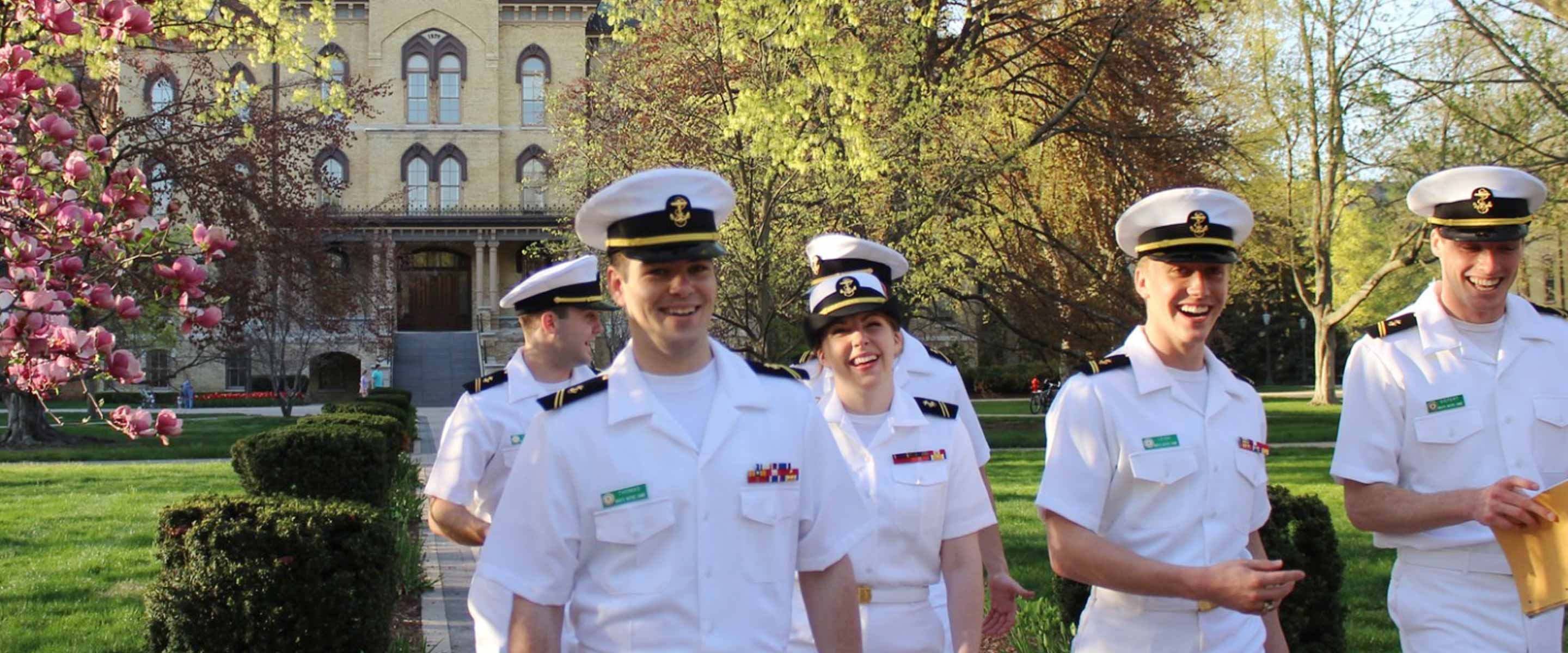 Navy Midshipman walk together at the Naval Academy