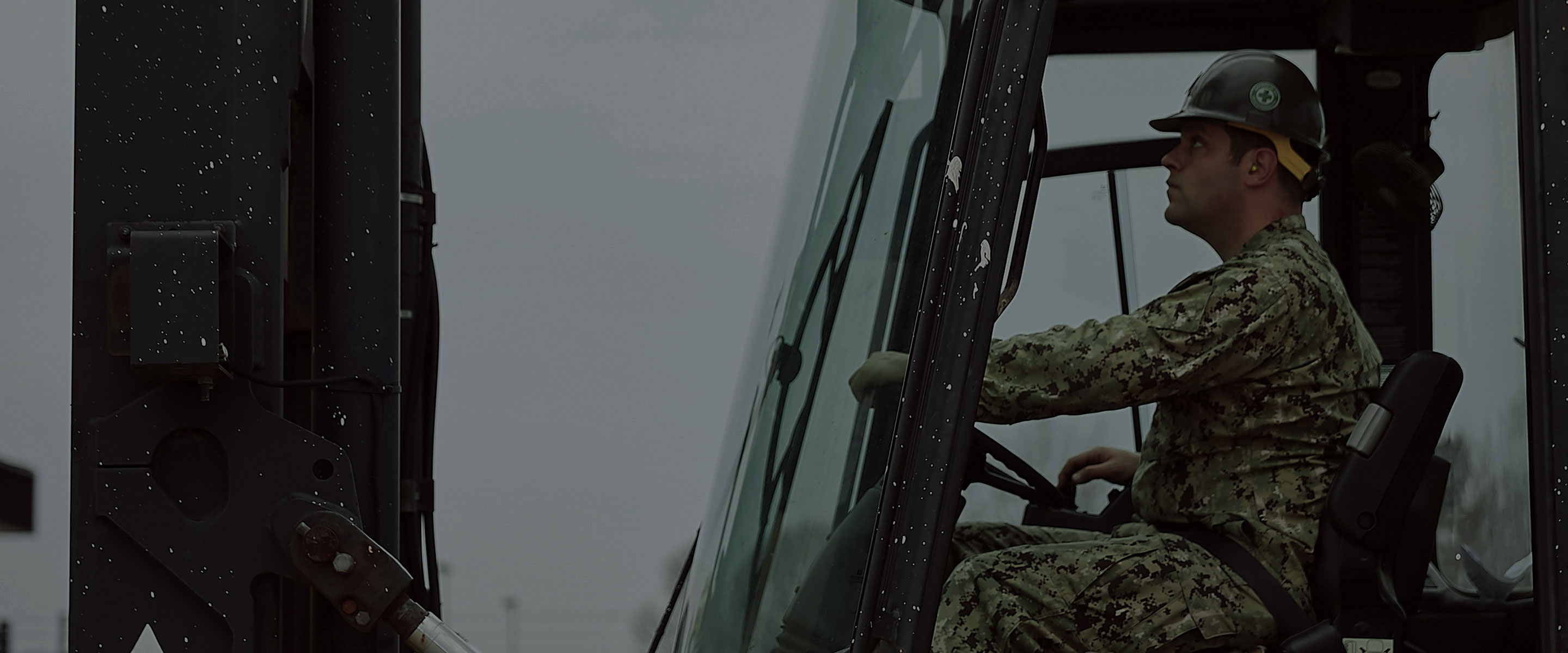 Navy Seabee Michael Ivey operates a forklift on a base in Norfolk