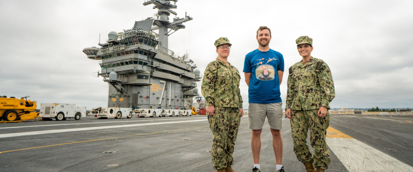 YouTuber William Osman poses for a photo aboard a navy battleship