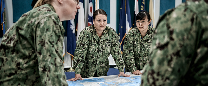 Myah Riggans, Navy linguist CTI, meets with teammates in Bahrain