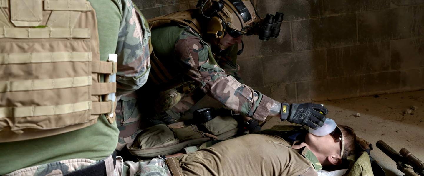 A United States Navy Hospital Corpsman (Advanced Technical Field) provides oxygen to a fellow Sailor during an exercise.
